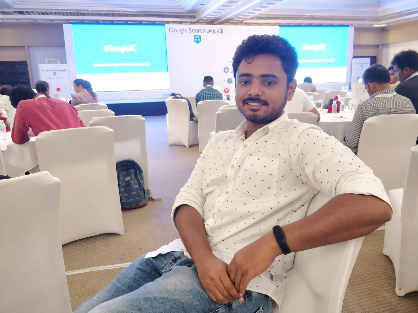 Thomas Androws seated at a Google Search conference in Chennai